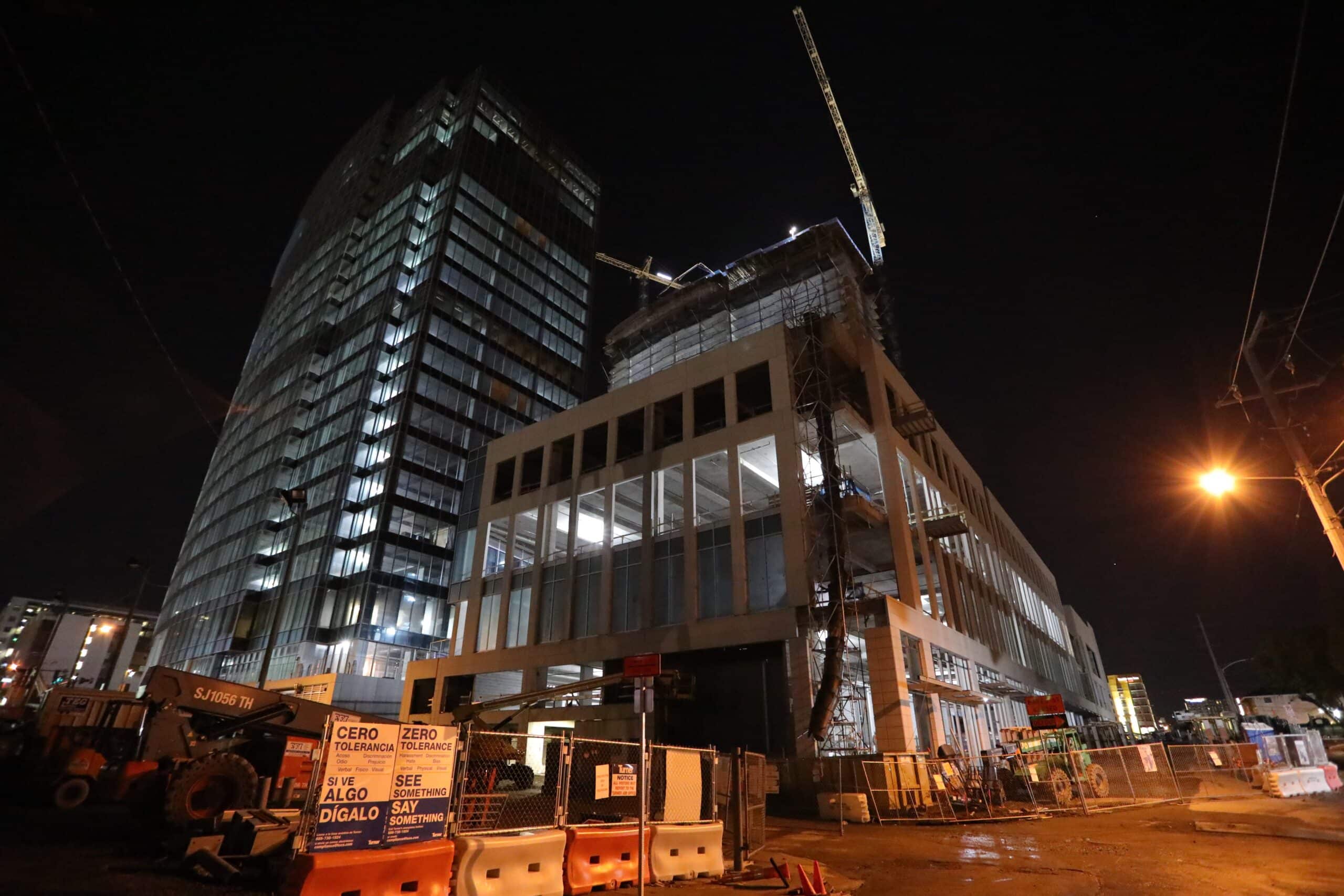 concrete parking garage under construction at night